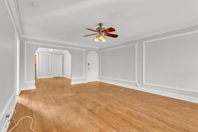 unfurnished living room with ornamental molding, ceiling fan, and light hardwood / wood-style floors