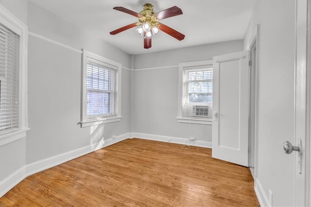 unfurnished room with light hardwood / wood-style flooring, ceiling fan, and plenty of natural light