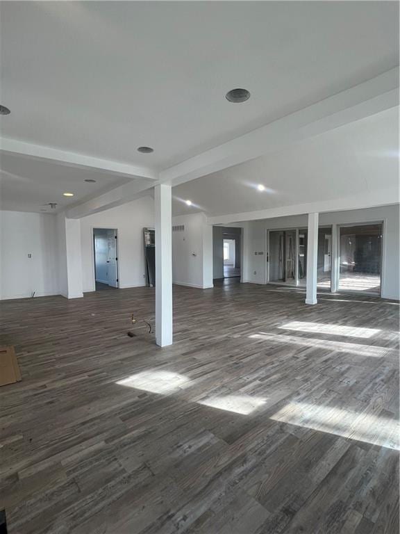 basement with dark hardwood / wood-style flooring