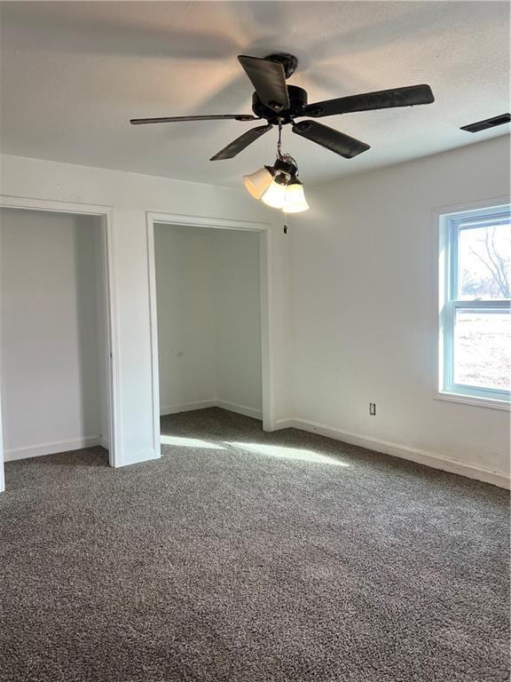 unfurnished bedroom with carpet flooring and ceiling fan