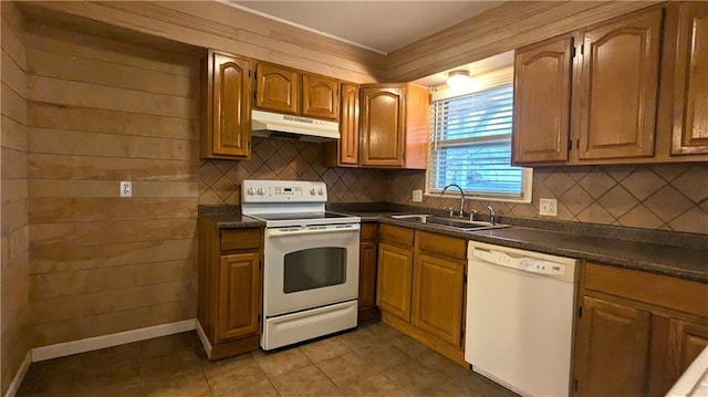 kitchen featuring sink, white appliances, light tile patterned flooring, and backsplash