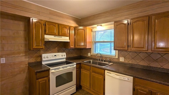 kitchen with sink, backsplash, and white appliances