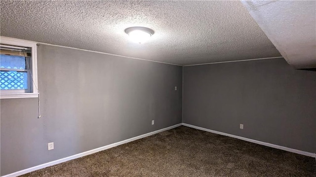 interior space featuring carpet and a textured ceiling