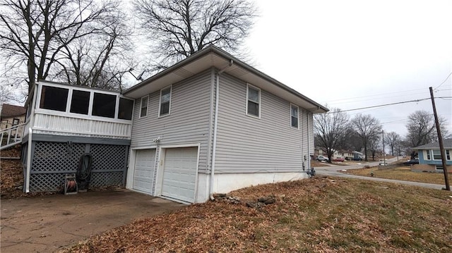 view of side of home with a garage