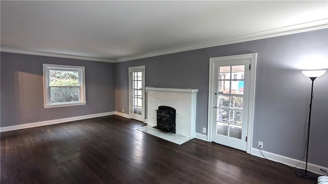 unfurnished living room with crown molding, dark hardwood / wood-style floors, and a wood stove