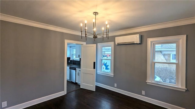 unfurnished dining area with an AC wall unit, sink, dark hardwood / wood-style flooring, ornamental molding, and a notable chandelier