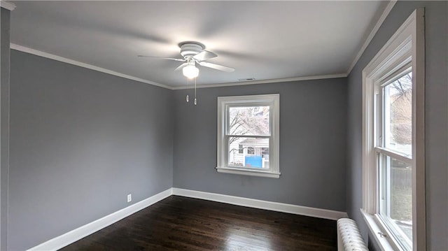 empty room featuring crown molding, ceiling fan, and dark hardwood / wood-style floors