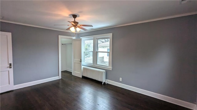 unfurnished bedroom featuring ornamental molding, dark hardwood / wood-style floors, radiator, a closet, and ceiling fan