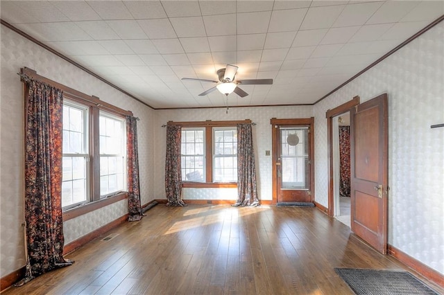 spare room with crown molding, ceiling fan, and hardwood / wood-style floors