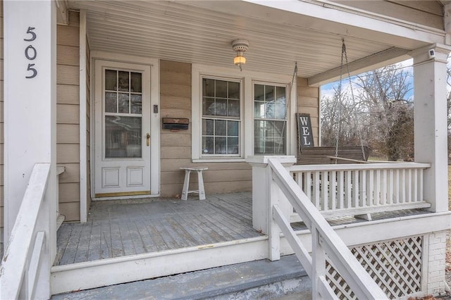 wooden deck featuring covered porch