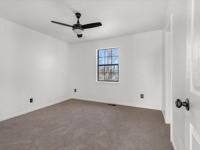 empty room featuring ceiling fan and carpet flooring