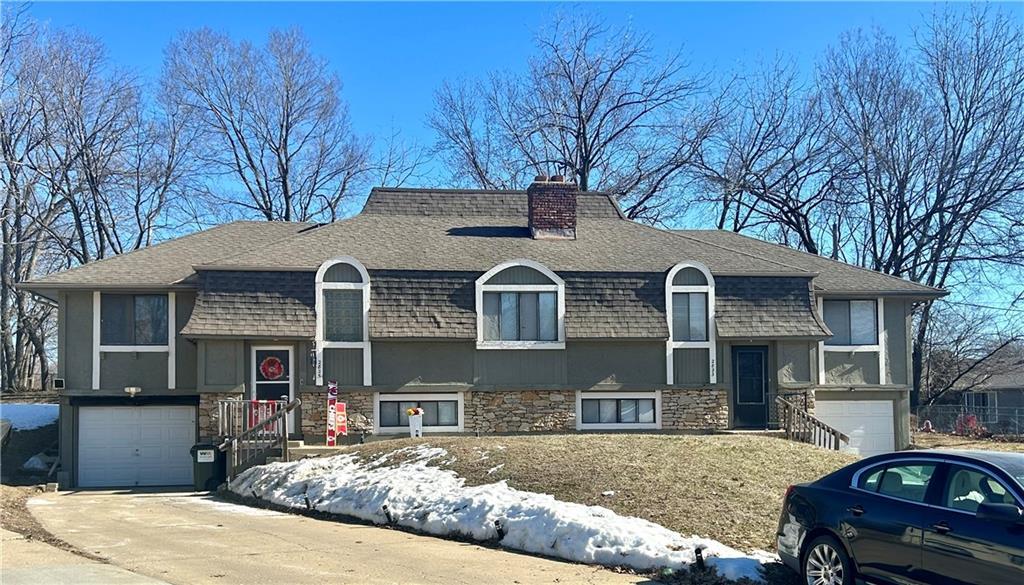 split foyer home featuring a garage