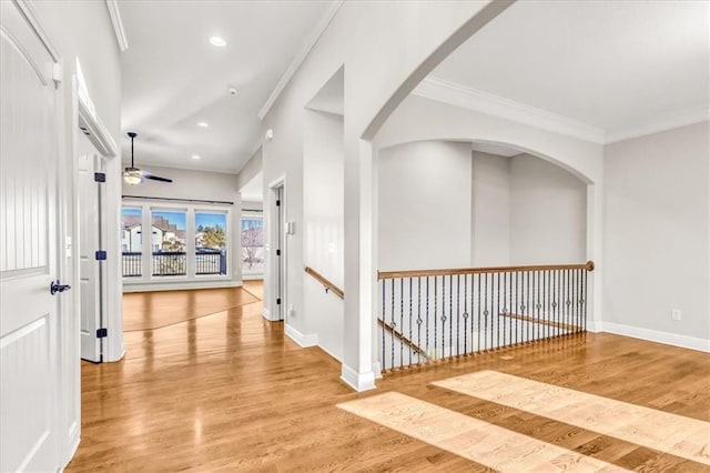 corridor featuring hardwood / wood-style floors and crown molding