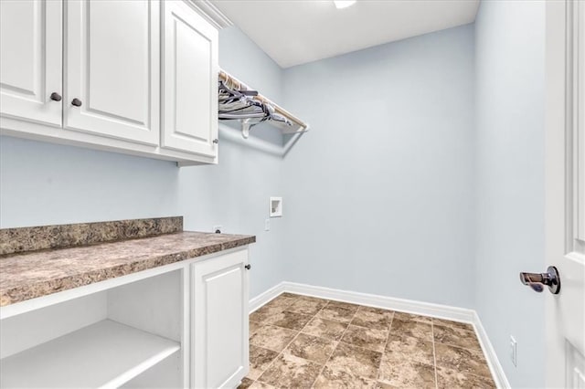 laundry room featuring cabinets and washer hookup