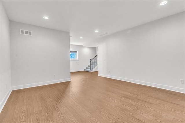 unfurnished living room with light hardwood / wood-style flooring