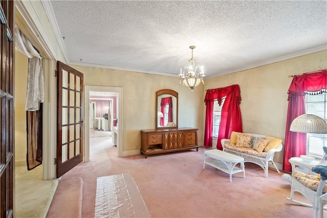 living area with crown molding, carpet flooring, a textured ceiling, and a chandelier