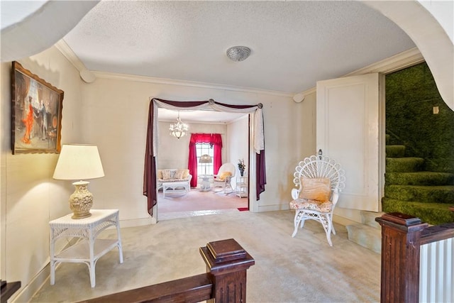 interior space featuring stairs, a textured ceiling, carpet, and crown molding