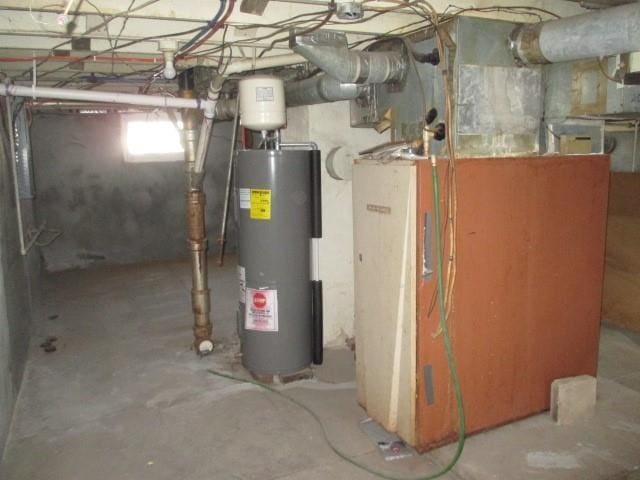 utility room featuring heating unit and water heater