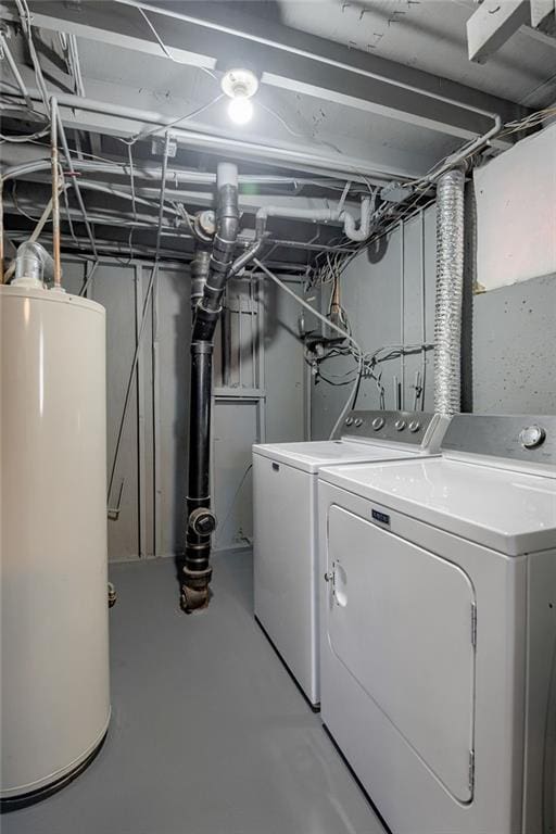 washroom featuring gas water heater and washer and dryer