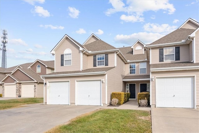 view of front of property with a garage and a front yard