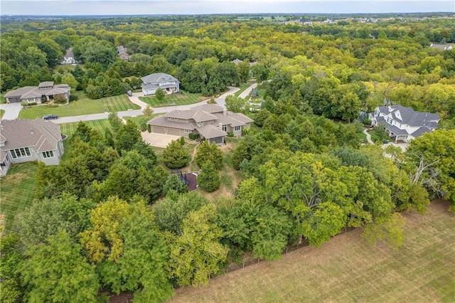 aerial view featuring a residential view and a view of trees