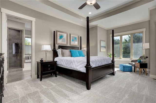 carpeted bedroom with connected bathroom, recessed lighting, baseboards, ornamental molding, and a tray ceiling