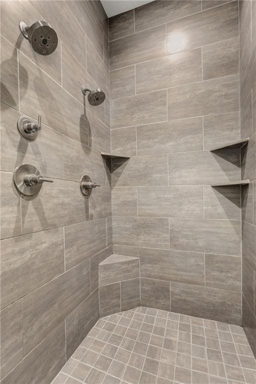 bathroom with tiled shower