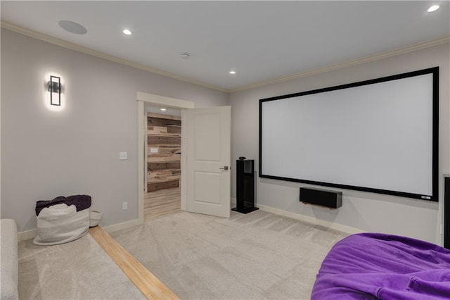 home theater featuring light carpet, ornamental molding, recessed lighting, and baseboards