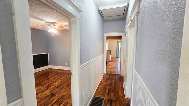 hallway featuring dark hardwood / wood-style flooring