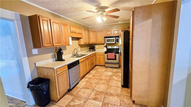 kitchen with sink, ceiling fan, appliances with stainless steel finishes, ornamental molding, and light brown cabinetry