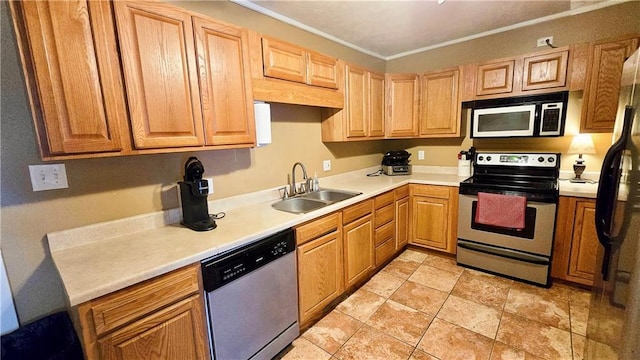 kitchen featuring sink, ornamental molding, and appliances with stainless steel finishes