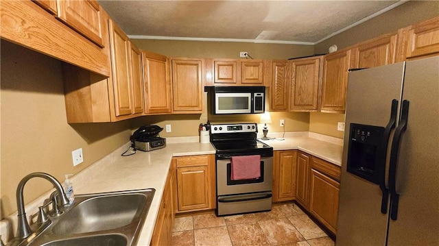 kitchen with stainless steel appliances, sink, and light tile patterned floors