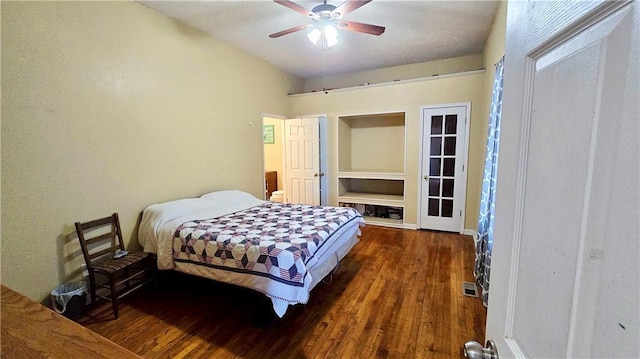 bedroom with dark wood-type flooring and ceiling fan