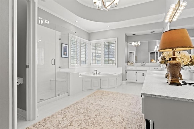 bathroom with a chandelier, tile patterned flooring, vanity, a shower stall, and a bath