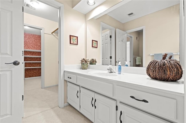 bathroom with vanity and visible vents