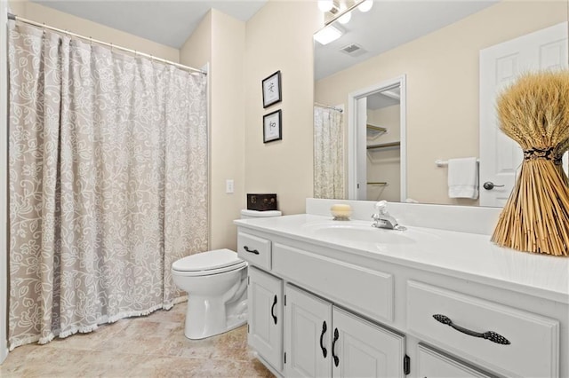 full bath featuring toilet, visible vents, and vanity