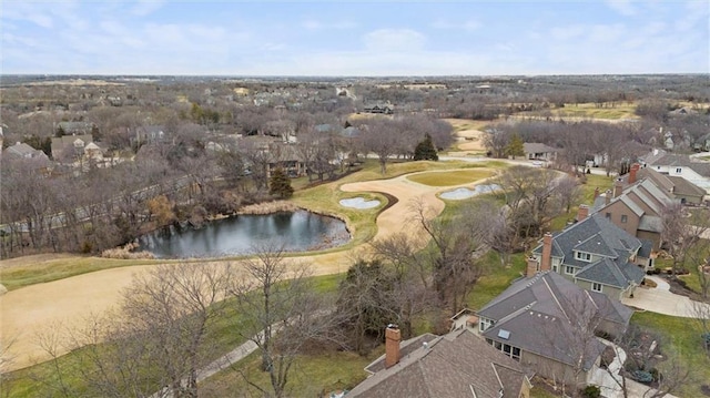 birds eye view of property featuring view of golf course, a water view, and a residential view