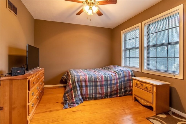 bedroom featuring ceiling fan and light hardwood / wood-style floors