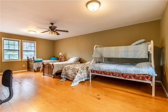 bedroom featuring wood-type flooring and ceiling fan