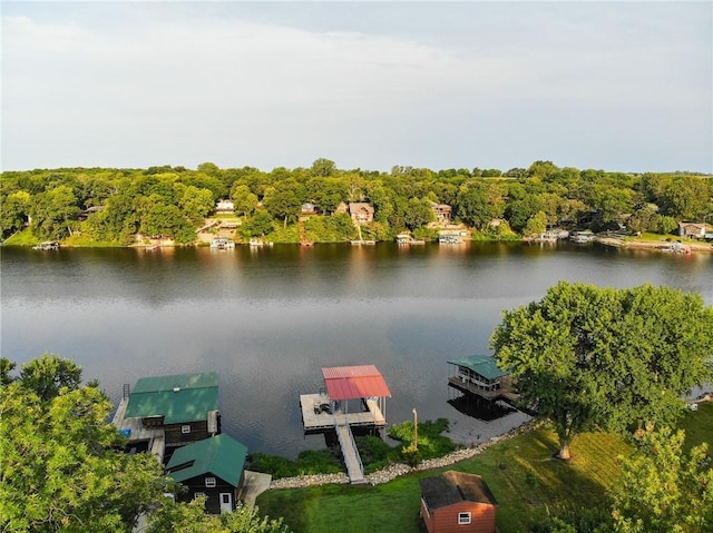 birds eye view of property with a water view