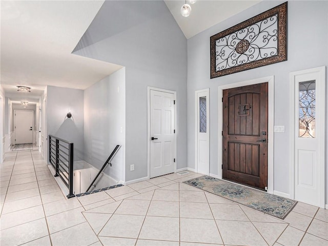 entrance foyer featuring baseboards and light tile patterned floors