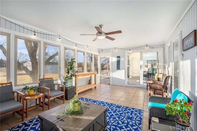 sunroom / solarium featuring a ceiling fan and a healthy amount of sunlight