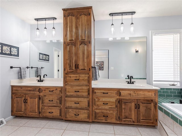 full bathroom featuring a relaxing tiled tub, vanity, and tile patterned floors