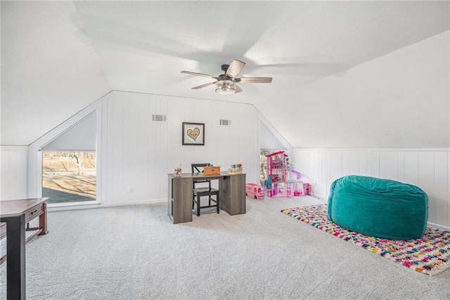 recreation room with carpet floors, lofted ceiling, visible vents, and ceiling fan