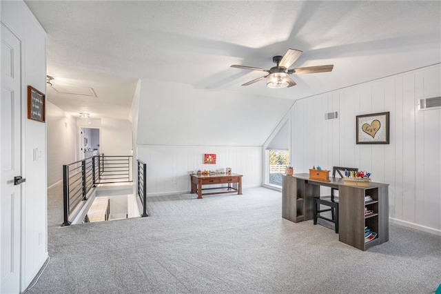 interior space with ceiling fan, carpet, and visible vents