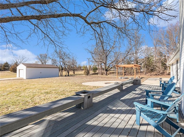 wooden terrace featuring a yard and an outdoor structure