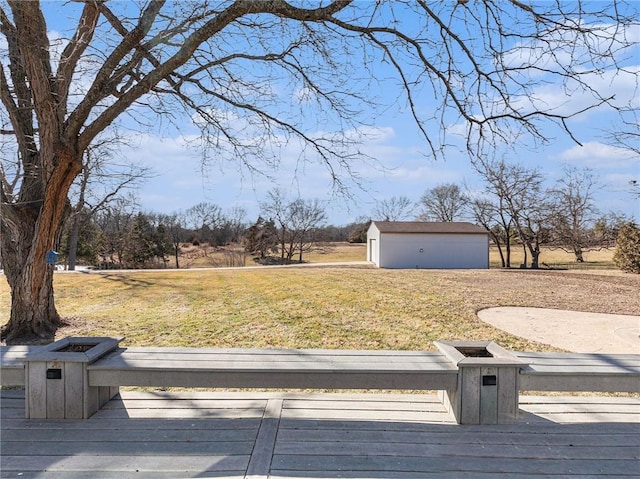 view of yard featuring an outdoor structure and a wooden deck