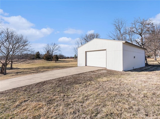 detached garage featuring driveway