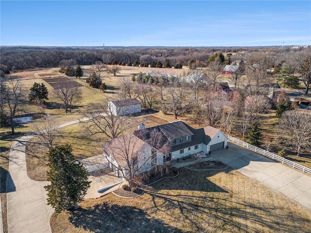 birds eye view of property with a rural view