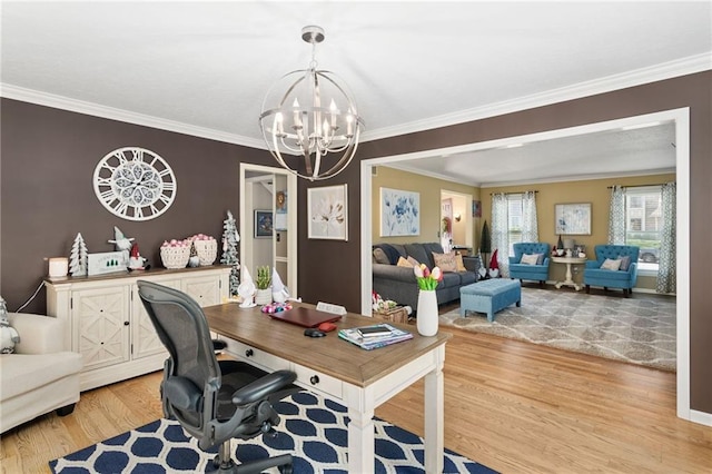 office space with crown molding, a chandelier, and light wood-type flooring